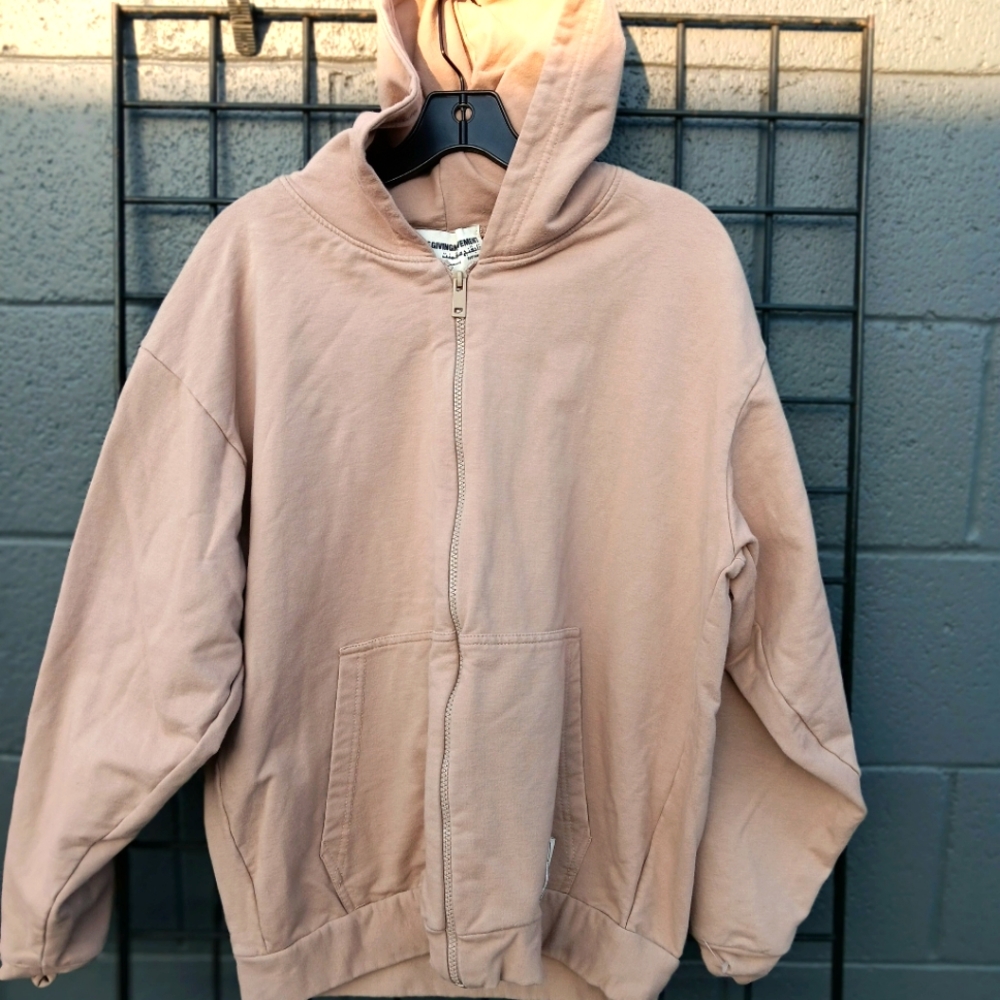 The Giving Movement zip-up sweater